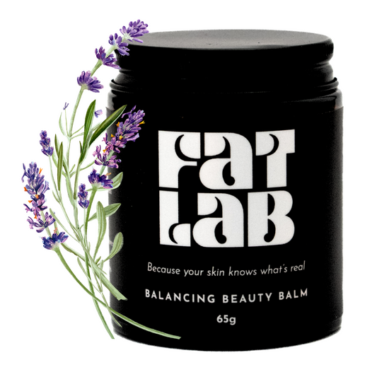 Black jar of Fat Lab balancing beauty balm with lavender sprig on a white background